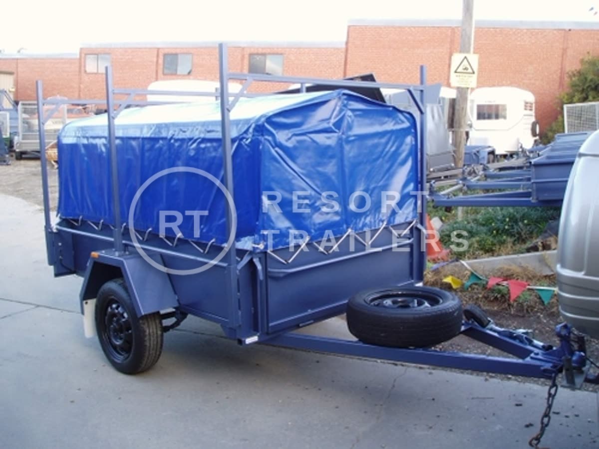 High sided box trailer with cage, vinyl cover, spare wheel and roof racks — built by Resort Trailers