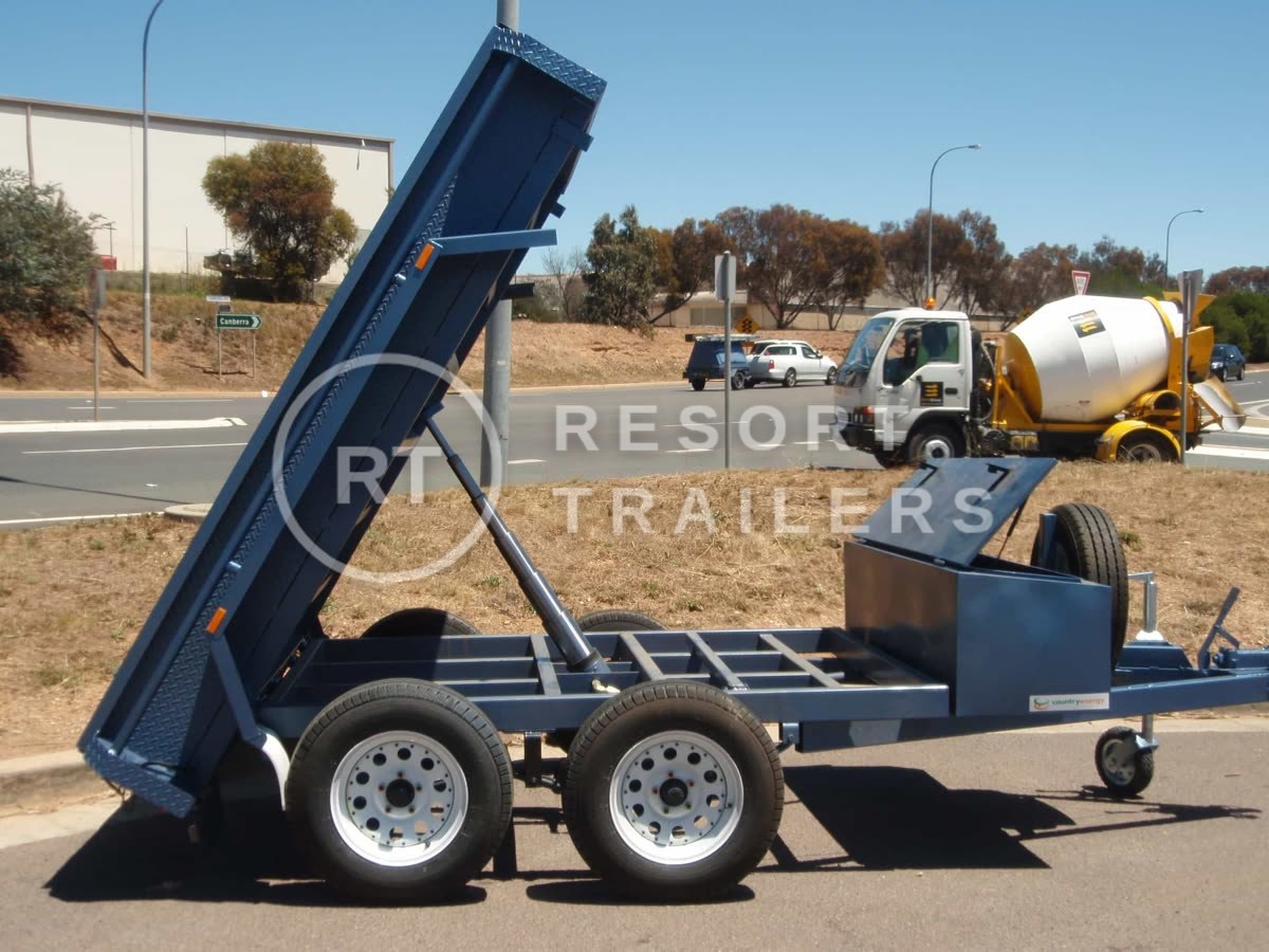 Dual axle tipping trailer with site box attached made for country energy — built by Resort Trailers