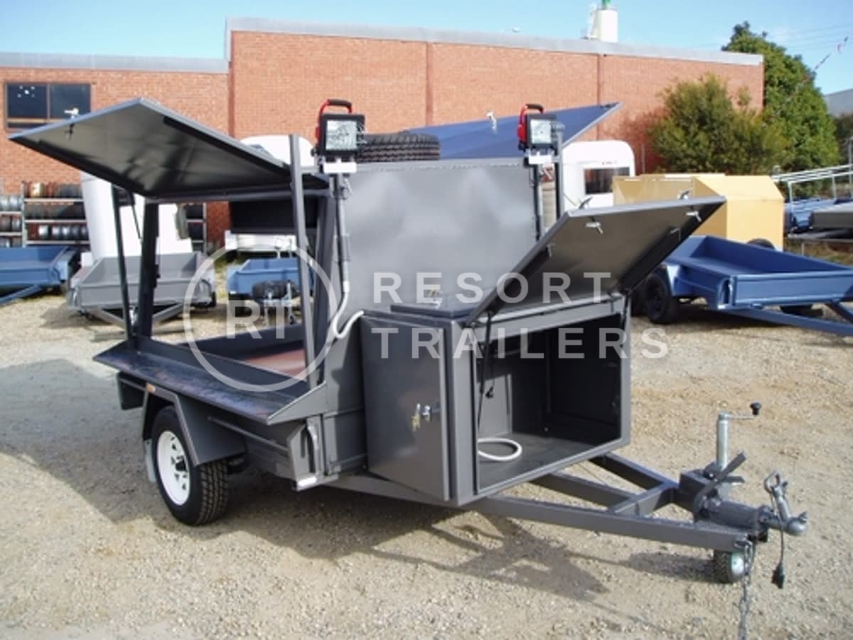 Tradesman trailer with large site box and flood lights doors open — built by Resort Trailers